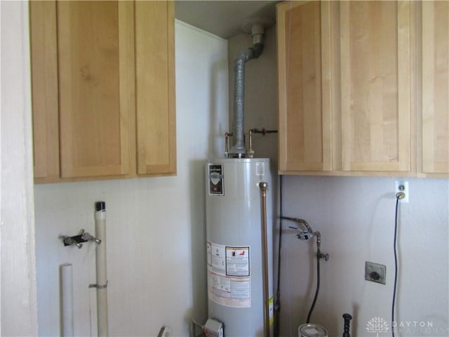 utility room with water heater