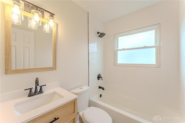 full bathroom featuring toilet, bathing tub / shower combination, and vanity