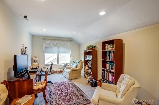 sitting room featuring lofted ceiling, visible vents, carpet flooring, and recessed lighting