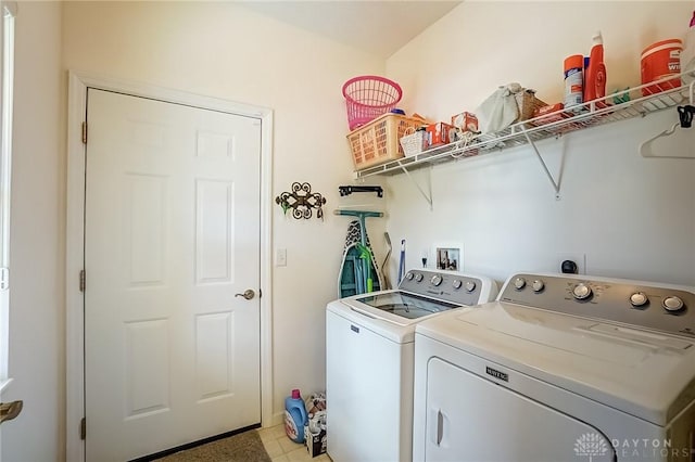 washroom featuring laundry area and separate washer and dryer