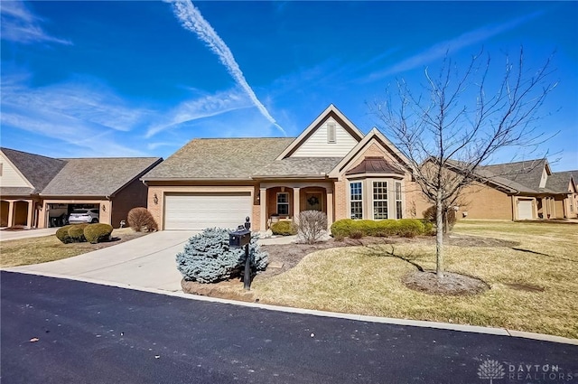 view of front of house with brick siding, driveway, an attached garage, and roof with shingles