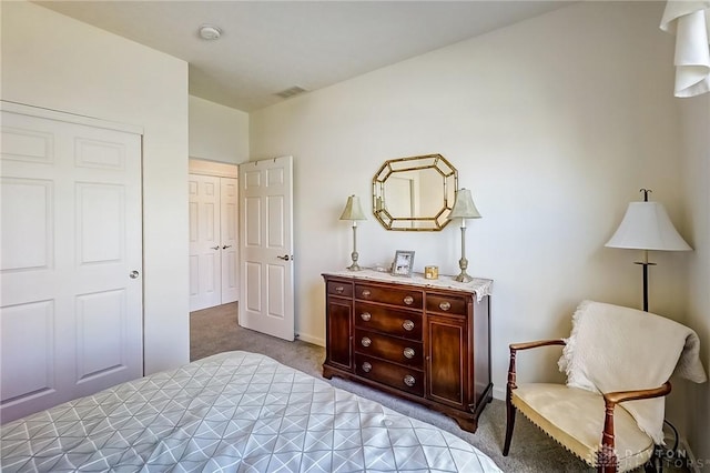 bedroom featuring carpet floors, a closet, and visible vents