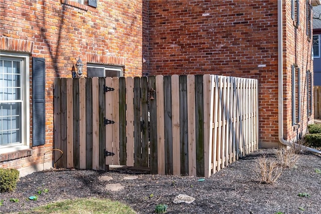 view of gate with fence