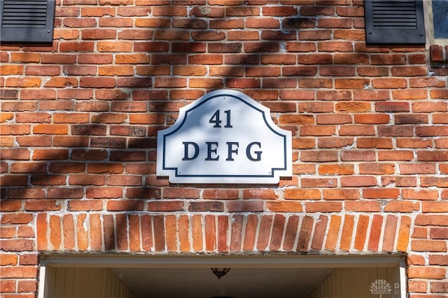 exterior details featuring brick siding