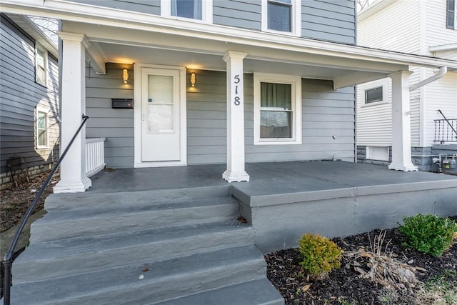 doorway to property featuring covered porch