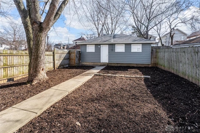 view of outbuilding featuring an outdoor structure and a fenced backyard