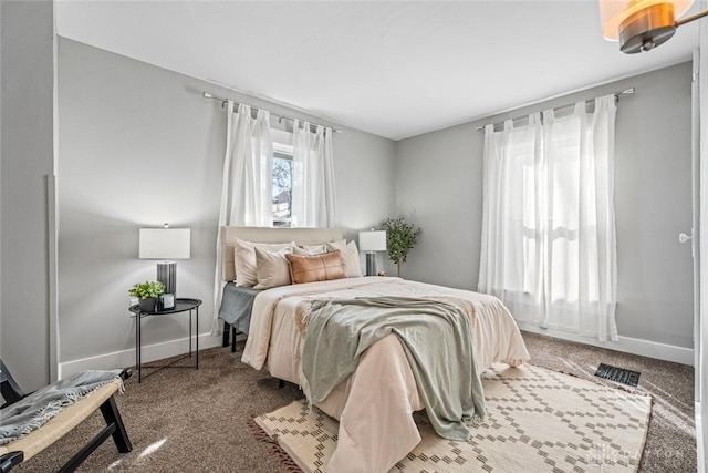 carpeted bedroom with baseboards