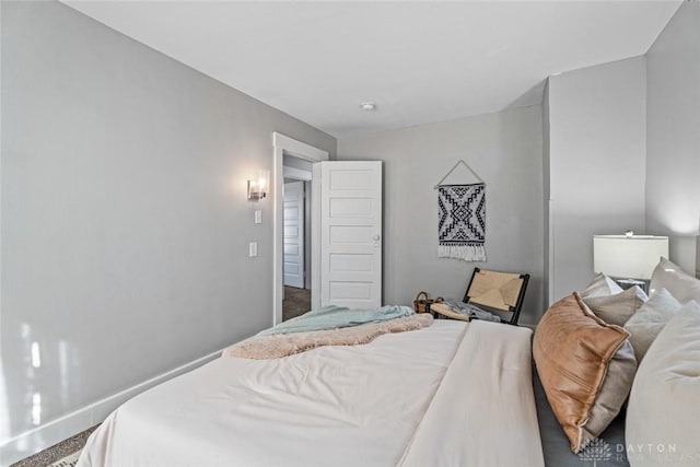 bedroom featuring baseboards