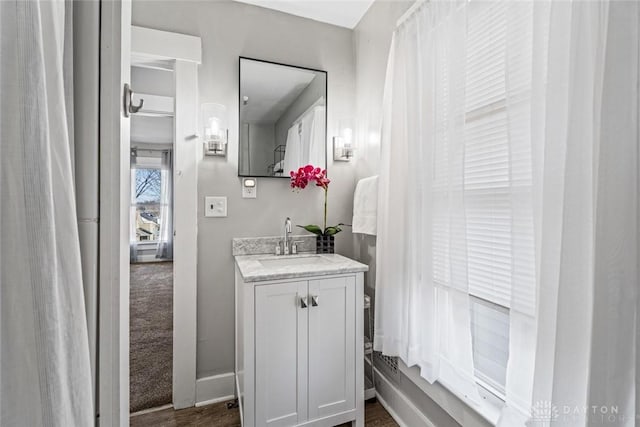 bathroom with vanity and baseboards