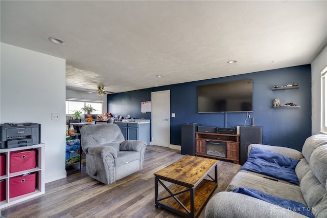 living room with ceiling fan, baseboards, wood finished floors, and recessed lighting