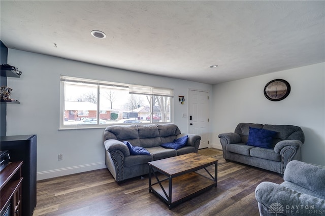 living room with baseboards and wood finished floors