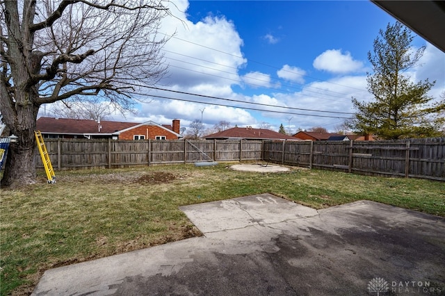 view of yard featuring a patio area and a fenced backyard