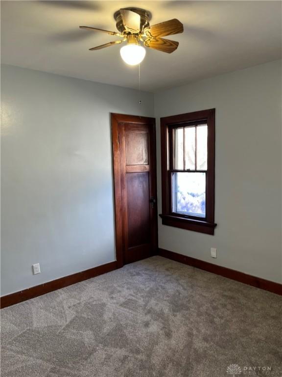 1205 Pursell Ave, Dayton, OH 45420 - carpeted empty room with a ceiling fan and baseboards