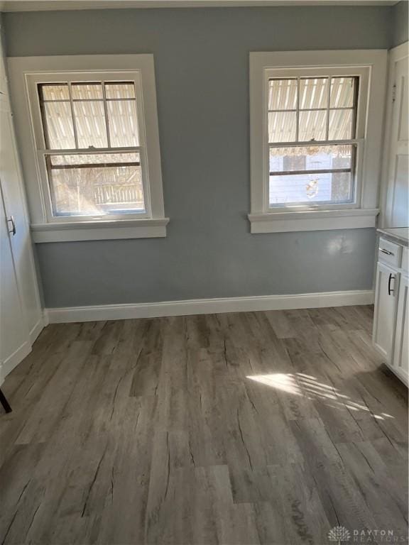 1205 Pursell Ave, Dayton, OH 45420 - unfurnished dining area featuring baseboards and wood finished floors