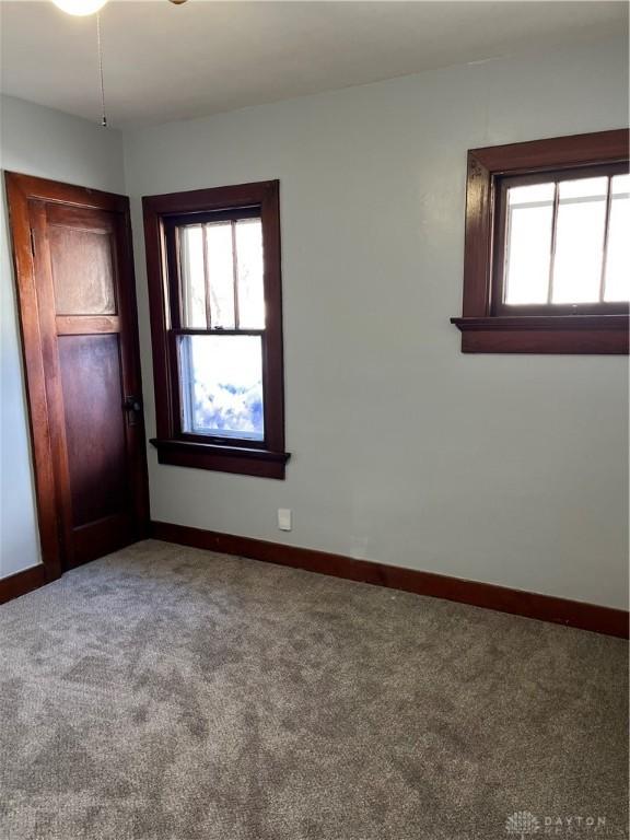 1205 Pursell Ave, Dayton, OH 45420 - carpeted empty room featuring a wealth of natural light and baseboards