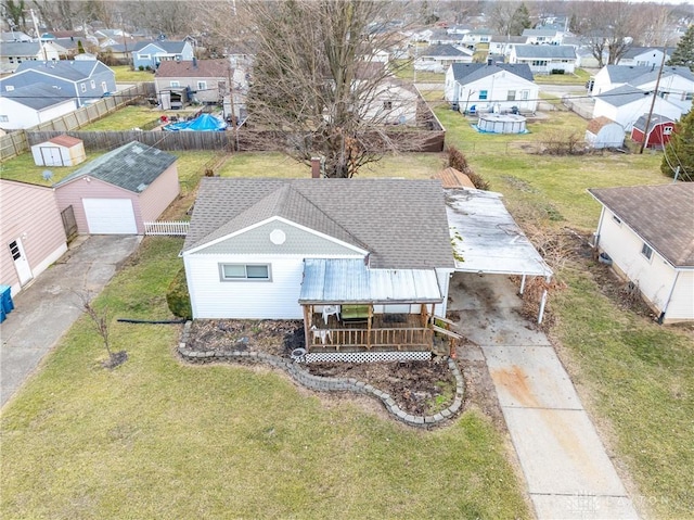 birds eye view of property with a residential view