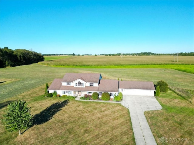 birds eye view of property with a rural view