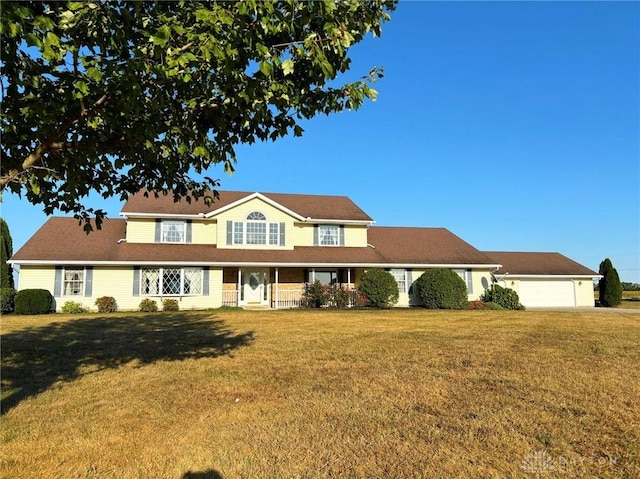 view of front of home featuring a garage and a front lawn