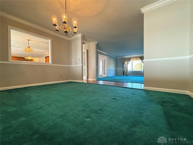 carpeted spare room with an inviting chandelier, baseboards, and crown molding