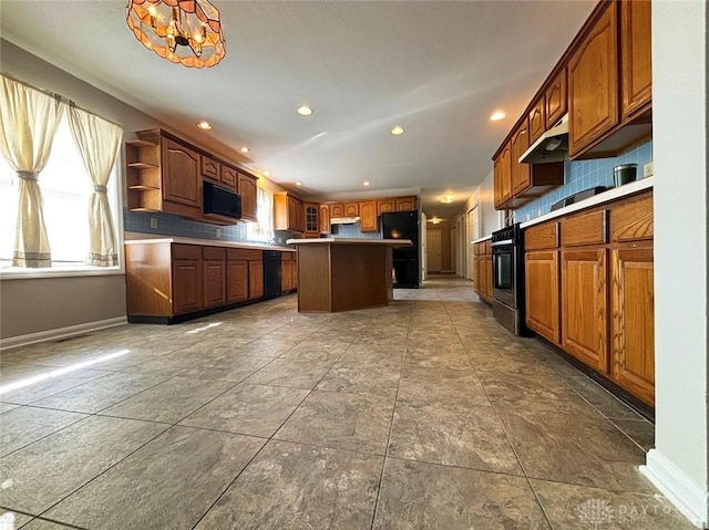 kitchen with baseboards, a kitchen island, black appliances, open shelves, and backsplash