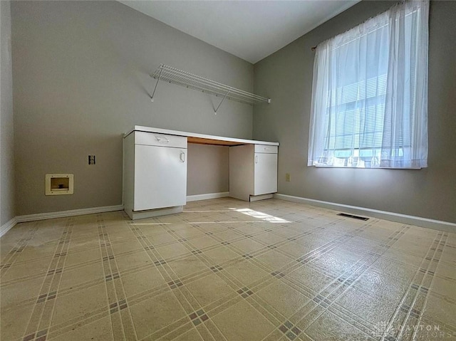 laundry area featuring laundry area, visible vents, and baseboards