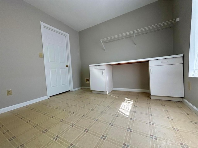 laundry room featuring baseboards