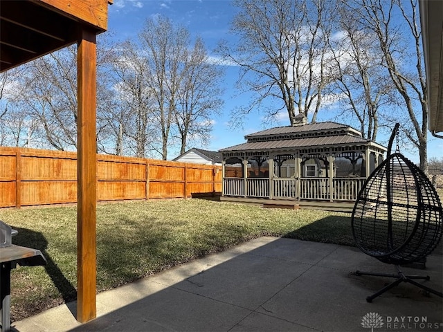 view of yard featuring a gazebo, a fenced backyard, and a patio area