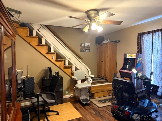 office space featuring a ceiling fan and dark wood-style floors