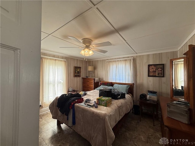 bedroom with ceiling fan and crown molding