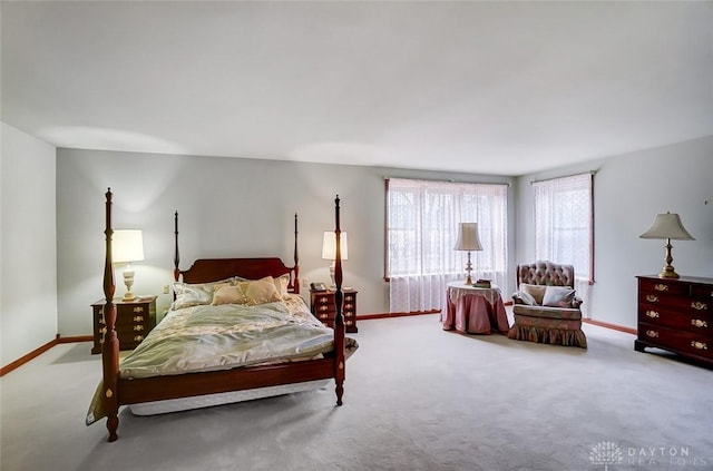 carpeted bedroom with baseboards