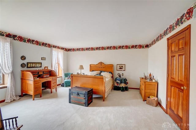 bedroom with carpet and baseboards