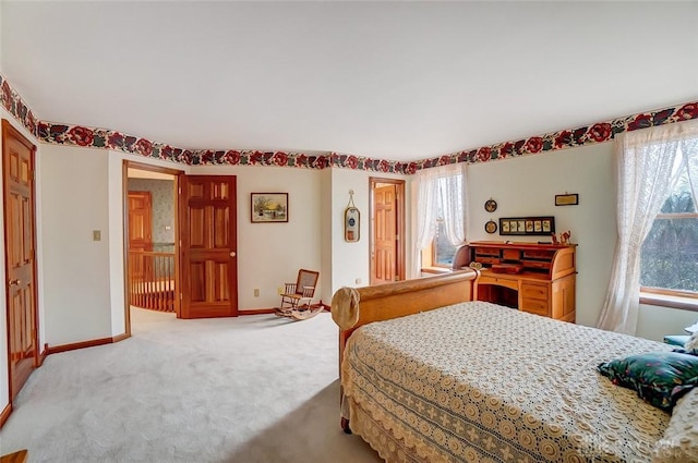 carpeted bedroom with baseboards