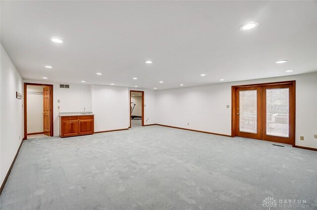 6485 Munger Rd, Dayton, OH 45459 - empty room featuring recessed lighting, light carpet, visible vents, baseboards, and french doors