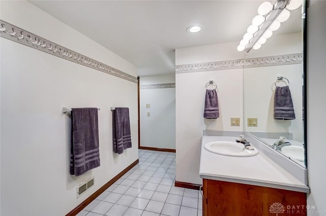 bathroom with tile patterned flooring, recessed lighting, visible vents, vanity, and baseboards