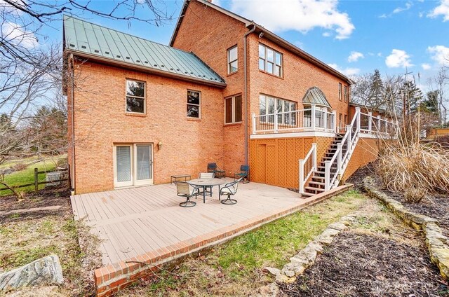 6485 Munger Rd, Dayton, OH 45459 - back of house featuring a standing seam roof, a wooden deck, metal roof, and brick siding