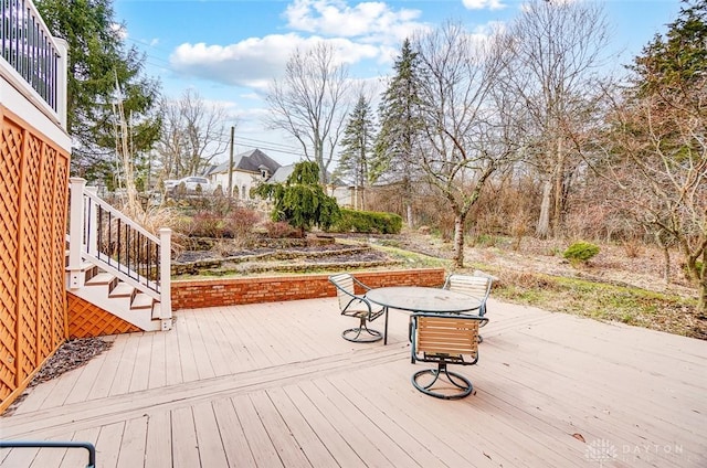 wooden deck featuring outdoor dining space