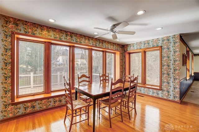 dining room featuring baseboards, recessed lighting, light wood-type flooring, and wallpapered walls