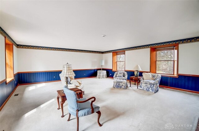 6485 Munger Rd, Dayton, OH 45459 - living area featuring wainscoting, carpet flooring, and visible vents