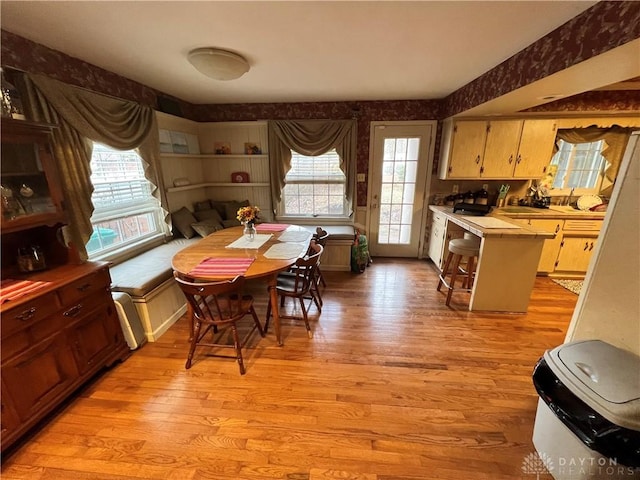 dining space with light wood finished floors