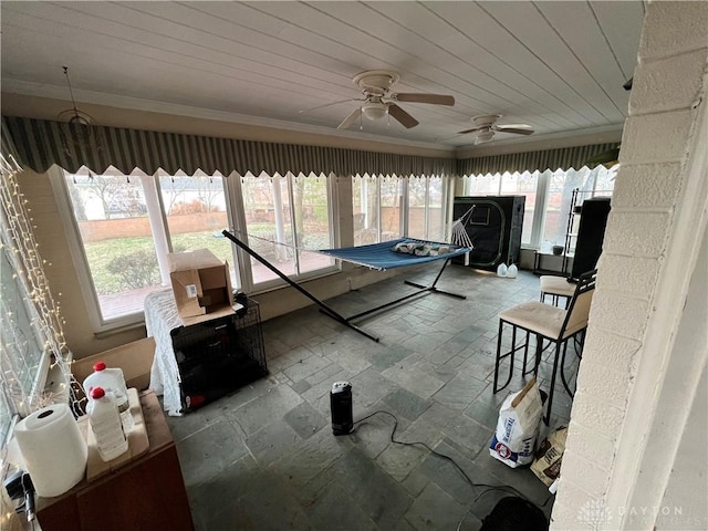 interior space with crown molding, wood ceiling, and stone tile floors