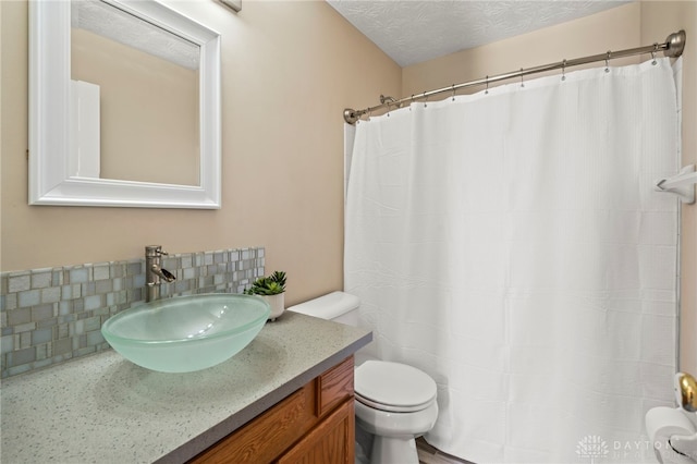 full bathroom with decorative backsplash, toilet, curtained shower, a textured ceiling, and vanity