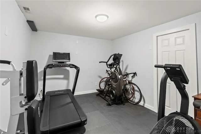 workout room featuring baseboards and visible vents