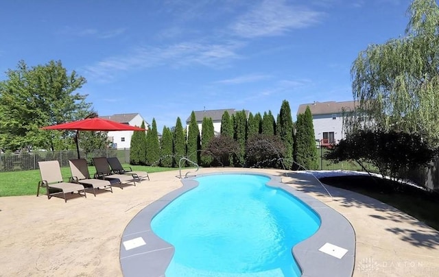 view of pool with a fenced in pool, fence, and a patio