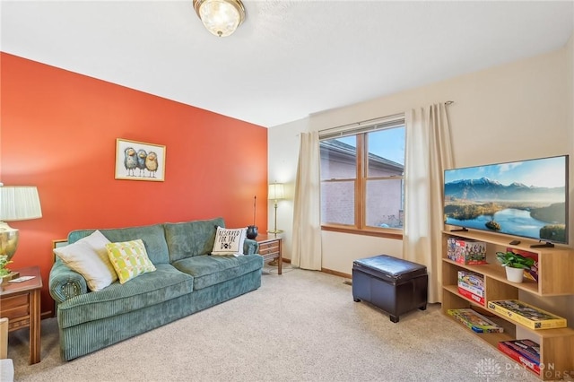 carpeted living room featuring baseboards