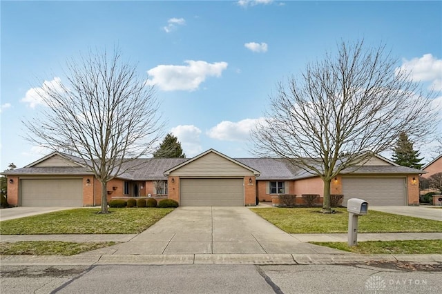 single story home with a garage, concrete driveway, brick siding, and a front yard