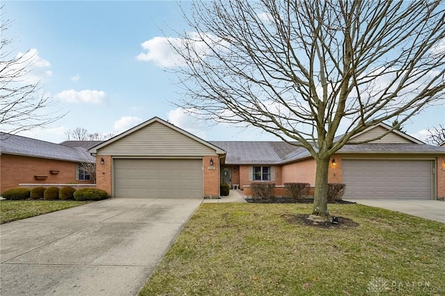 single story home featuring a garage, concrete driveway, brick siding, and a front lawn