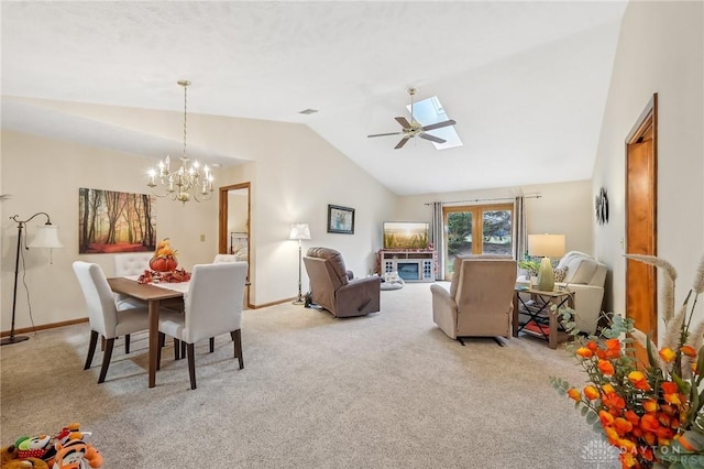 dining room featuring carpet floors, lofted ceiling with skylight, baseboards, and a chandelier