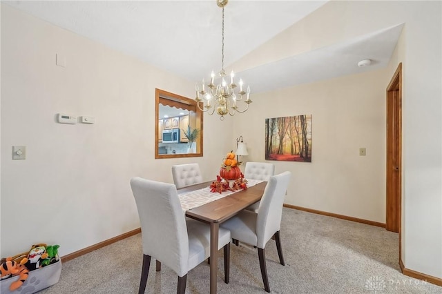 dining space with lofted ceiling, an inviting chandelier, carpet, and baseboards