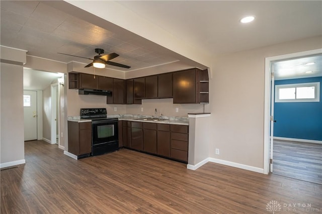 kitchen with under cabinet range hood, black range with electric stovetop, a sink, light countertops, and open shelves