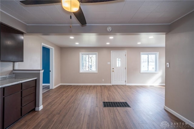 entrance foyer with a healthy amount of sunlight, visible vents, and wood finished floors